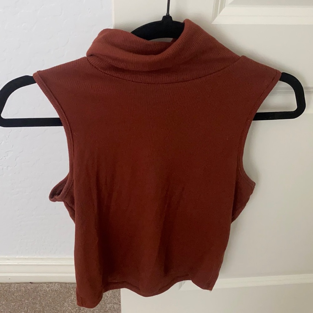 Burnt orange turtleneck sleeveless top